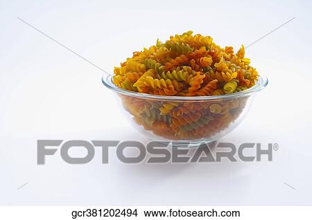 Picture - Close-up of a bowl of uncooked fusilli. Fotosearch