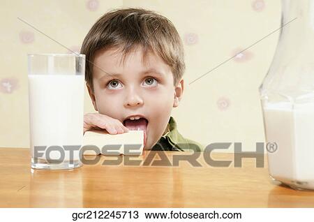 Close-up of a boy eating breakfast View Large Photo Image Stock Image - Close-up of a boy eating breakfast. Fotosearch