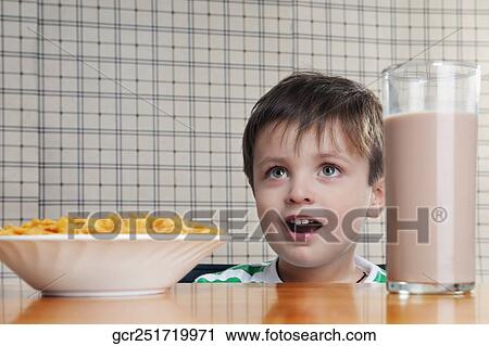 Close-up of a boy having breakfast View Large Photo Image Stock Image - Close-up of a boy having breakfast. Fotosearch