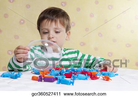 Close-up of a boy holding a bowl View Large Photo Image Stock Image - Close-up of a boy holding a bowl. Fotosearch