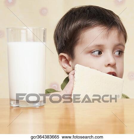 Stock Photography - Close-up of a boy holding a chocolate bar. Fotosearch