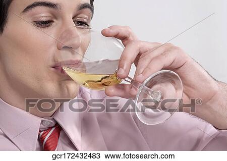 Close-up of a businessman drinking wine View Large Photo Image Stock Image - Close-up of a businessman drinking wine. Fotosearch
