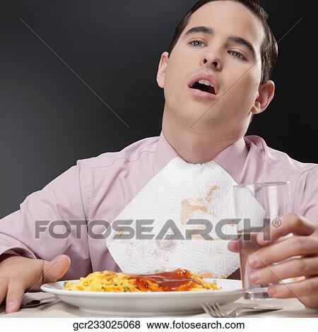 Close-up of a businessman eating pasta View Large Photo Image Stock Photo - Close-up of a businessman eating pasta. Fotosearch