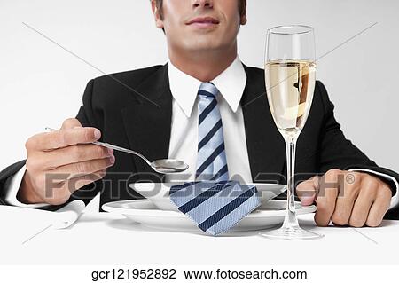 Close-up of a businessman with his tie in a soup bowl View Large Photo Image Stock Image - Close-up of a businessman with his tie in a soup bowl. Fotosearch