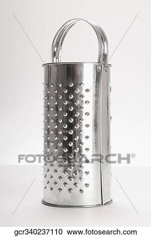 Close-up of a cheese grater View Large Photo Image Stock Image - Close-up of a cheese grater. Fotosearch
