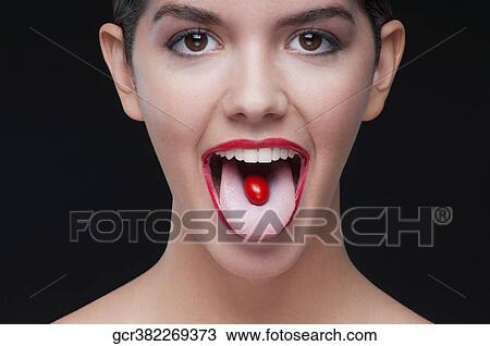 Close-up of a cherry tomato on a woman's tongue View Large Photo Image Stock Image - Close-up of a cherry tomato on a woman's tongue. Fotosearch