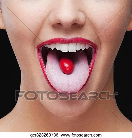 Close-up of a cherry tomato on a woman's tongue View Large Photo Image Stock Photograph - Close-up of a cherry tomato on a woman's tongue. Fotosearch
