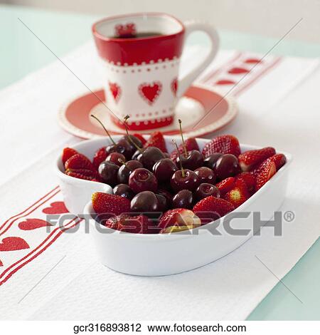 Close-up of a cup of coffee with assorted berries View Large Photo Image Stock Image - Close-up of a cup of coffee with assorted berries. Fotosearch