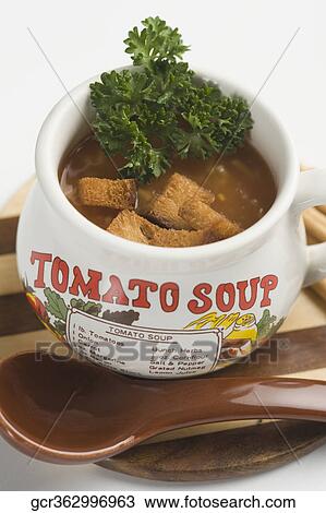 Close-up of a cup of tomato soup with bread cubes View Large Photo Image Stock Image - Close-up of a cup of tomato soup with bread cubes. Fotosearch