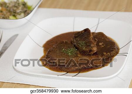 Close-up of a dish of braised lamb View Large Photo Image Stock Image - Close-up of a dish of braised lamb. Fotosearch