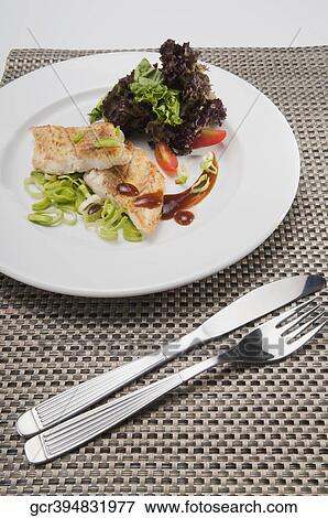 Close-up of a dish of fish fillets View Large Photo Image Stock Photo - Close-up of a dish of fish fillets. Fotosearch