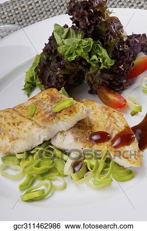 Close-up of a dish of fish fillets View Large Photo Image Stock Photograph - Close-up of a dish of fish fillets. Fotosearch