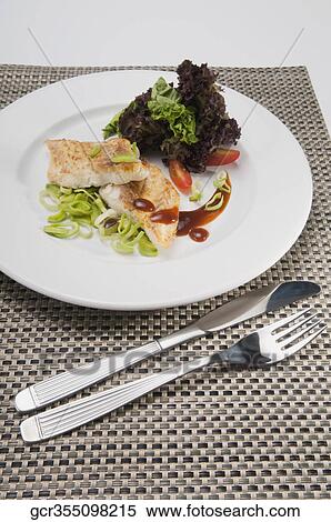 Close-up of a dish of fish fillets View Large Photo Image Stock Photography - Close-up of a dish of fish fillets. Fotosearch