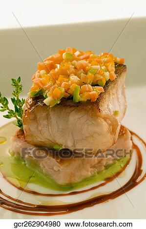 Close-up of a fish steak garnished with chopped peppers View Large Photo Image Stock Image - Close-up of a fish steak garnished with chopped peppers. Fotosearch
