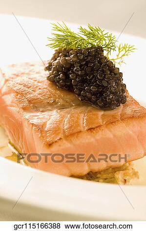 Close-up of a fish steak garnished with caviar View Large Photo Image Stock Photo - Close-up of a fish steak garnished with caviar. Fotosearch