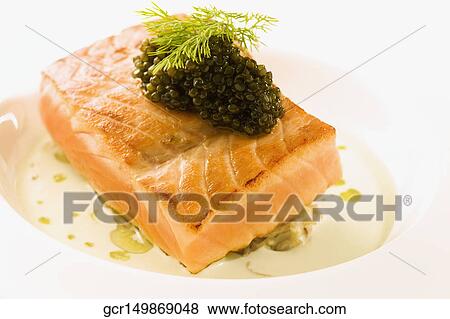 Close-up of a fish steak garnished with caviar View Large Photo Image Stock Photo - Close-up of a fish steak garnished with caviar. Fotosearch