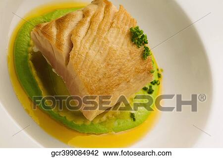 Close-up of a fish steak on a bed of sauce View Large Photo Image Stock Image - Close-up of a fish steak on a bed of sauce. Fotosearch