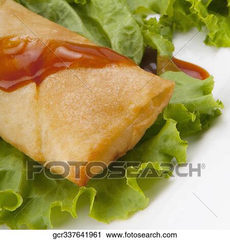 Close-up of a fried dough pocket on lettuce View Large Photo Image Stock Image - Close-up of a fried dough pocket on lettuce. Fotosearch
