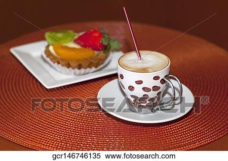 Close-up of a fruit tart with a cup of coffee View Large Photo Image Stock Photography - Close-up of a fruit tart with a cup of coffee. Fotosearch
