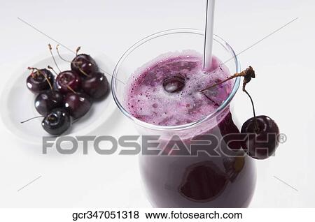Close-up of a glass of cherry juice with cherries View Large Photo Image Stock Photo - Close-up of a glass of cherry juice with cherries. Fotosearch