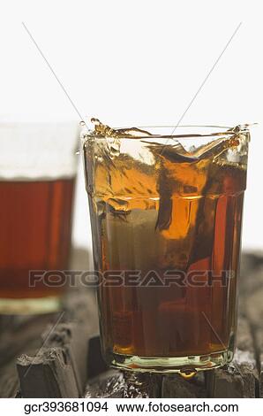 Close-up of a glass of herbal tea View Large Photo Image Picture - Close-up of a glass of herbal tea. Fotosearch