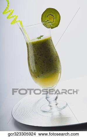 Picture - Close-up of a glass of kiwi cocktail. Fotosearch