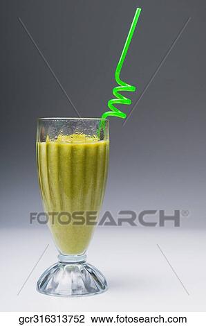 Close-up of a glass of kiwi cocktail View Large Photo Image Stock Image - Close-up of a glass of kiwi cocktail. Fotosearch