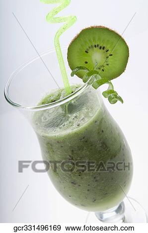 Close-up of a glass of kiwi cocktail View Large Photo Image Stock Photo - Close-up of a glass of kiwi cocktail. Fotosearch