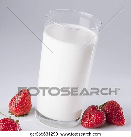 Close-up of a glass of milk and strawberries View Large Photo Image Stock Image - Close-up of a glass of milk and strawberries. Fotosearch
