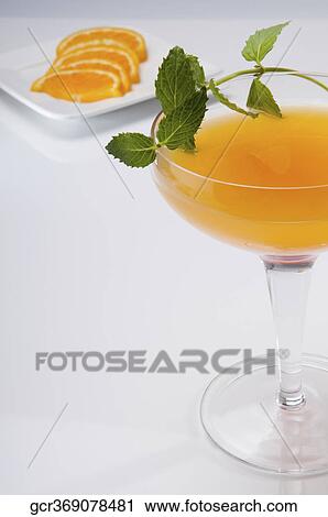 Close-up of a glass of orange juice with orange slices View Large Photo Image Stock Image - Close-up of a glass of orange juice with orange slices. Fotosearch