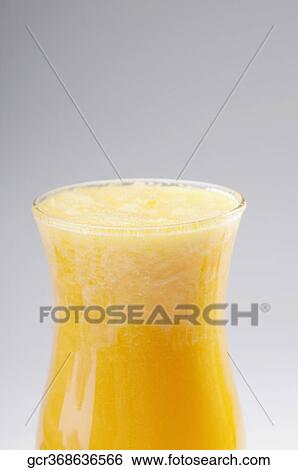 Close-up of a glass of orange juice View Large Photo Image Stock Photograph - Close-up of a glass of orange juice. Fotosearch