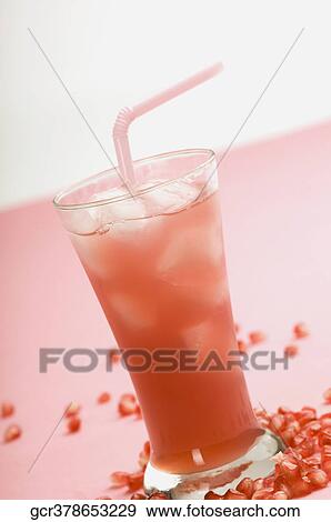 Close-up of a glass of pomegranate juice View Large Photo Image Stock Photo - Close-up of a glass of pomegranate juice. Fotosearch
