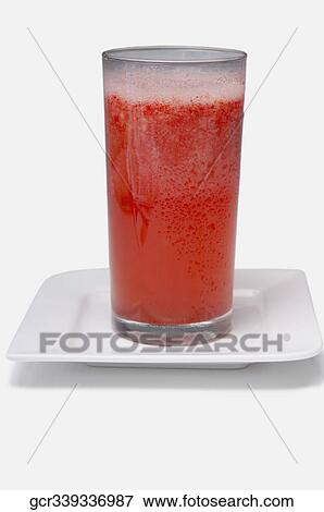 Close-up of a glass of strawberry juice View Large Photo Image Stock Photo - Close-up of a glass of strawberry juice. Fotosearch