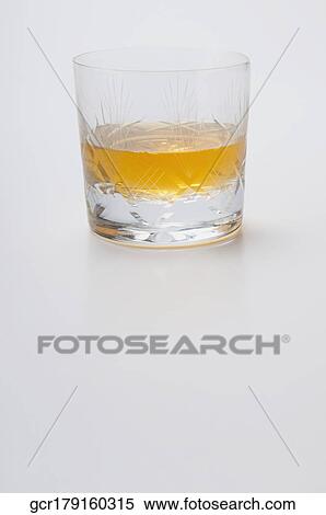 Close-up of a glass of whiskey View Large Photo Image Stock Photography - Close-up of a glass of whiskey. Fotosearch