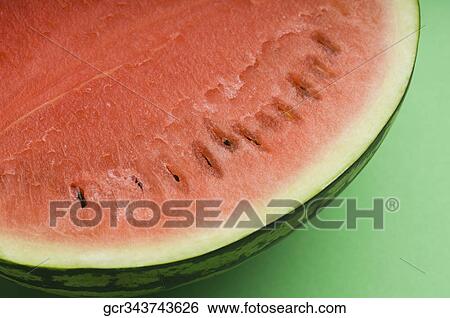 Close-up of a half of watermelon View Large Photo Image Stock Photograph - Close-up of a half of watermelon. Fotosearch
