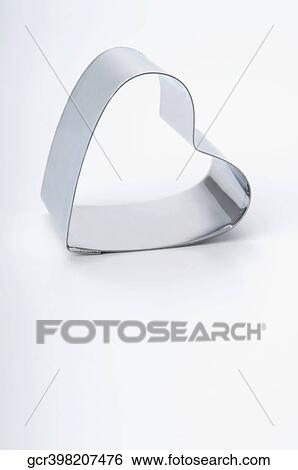 Stock Photograph - Close-up of a heart shaped cookie cutter. Fotosearch