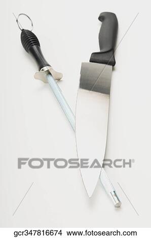 Close-up of a knife and a sharpening steel View Large Photo Image Picture - Close-up of a knife and a sharpening steel. Fotosearch