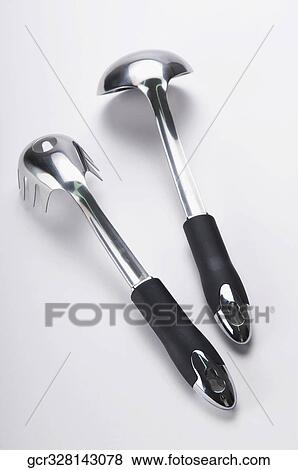 Stock Photo - Close-up of a ladle and a spaghetti spoon. Fotosearch
