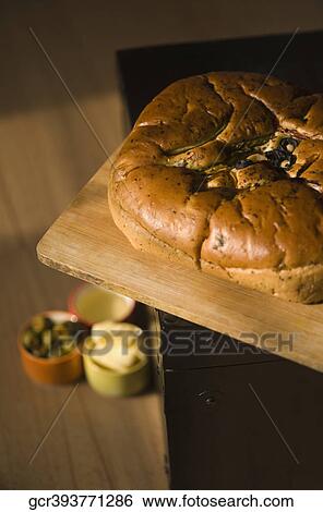 Close-up of a loaf of bread with olives and butter View Large Photo Image Stock Photograph - Close-up of a loaf of bread with olives and butter. Fotosearch