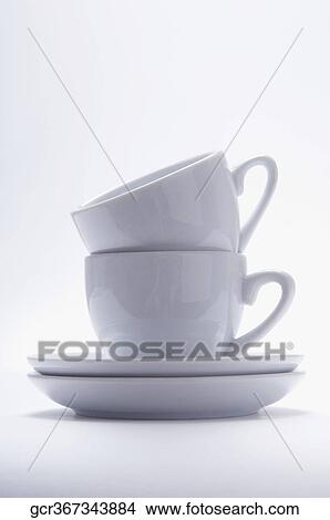 Close-up of a pile of two cups and saucers View Large Photo Image Picture - Close-up of a pile of two cups and saucers. Fotosearch