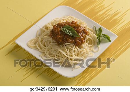 Close-up of a plate of cooked pasta with raw pasta sticks View Large Photo Image Stock Image - Close-up of a plate of cooked pasta with raw pasta sticks. Fotosearch