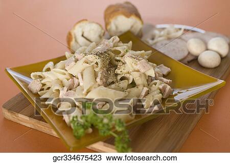 Close-up of a plate of pasta with breads View Large Photo Image Stock Image - Close-up of a plate of pasta with breads. Fotosearch