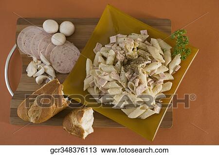 Stock Image - Close-up of a plate of pasta with breads. Fotosearch