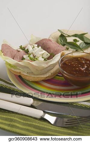 Close-up of a sandwich served with sauce View Large Photo Image Stock Image - Close-up of a sandwich served with sauce. Fotosearch