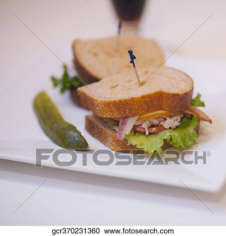 Stock Image - Close-up of a sandwich with pickles. Fotosearch