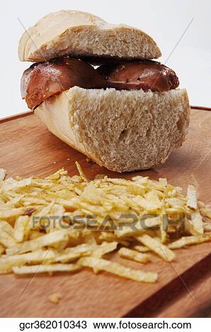 Close-up of a sausage sandwich and chips View Large Photo Image Stock Image - Close-up of a sausage sandwich and chips. Fotosearch