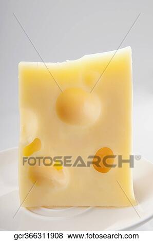 Close-up of a slice of emmenthal cheese View Large Photo Image Stock Photo - Close-up of a slice of emmenthal cheese. Fotosearch