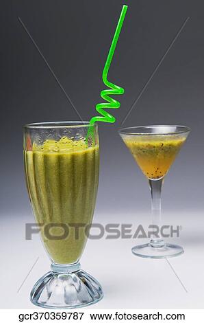 Close-up of a spiral straw in kiwi fruit cocktail View Large Photo Image Stock Photo - Close-up of a spiral straw in kiwi fruit cocktail. Fotosearch