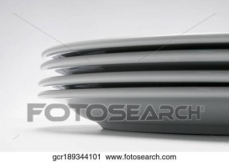 Close-up of a stack of plates View Large Photo Image Stock Image - Close-up of a stack of plates. Fotosearch