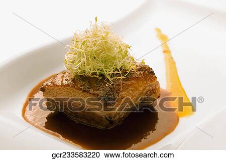 Close-up of a steak served with sauce View Large Photo Image Stock Image - Close-up of a steak served with sauce. Fotosearch
